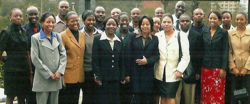 Group of hospitality staff posing together indoors